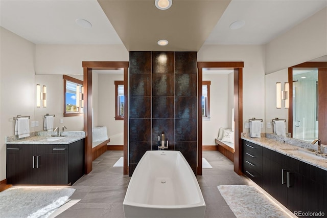 bathroom featuring plus walk in shower and vanity