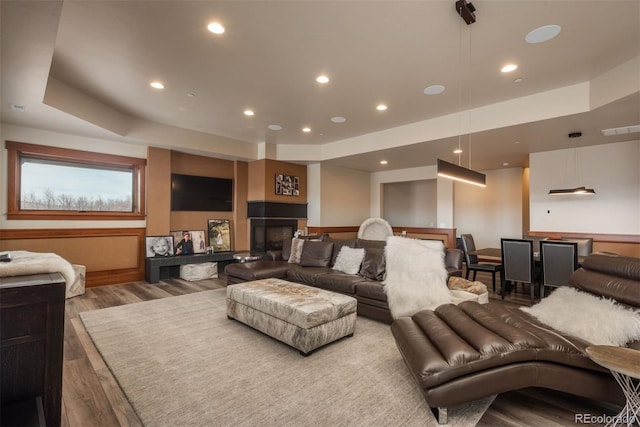 living room with a fireplace and hardwood / wood-style flooring