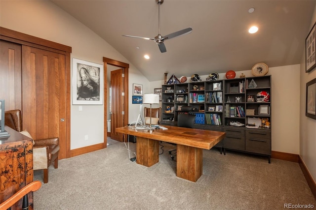 carpeted home office featuring vaulted ceiling and ceiling fan