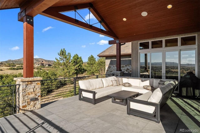 view of patio with outdoor lounge area and a mountain view