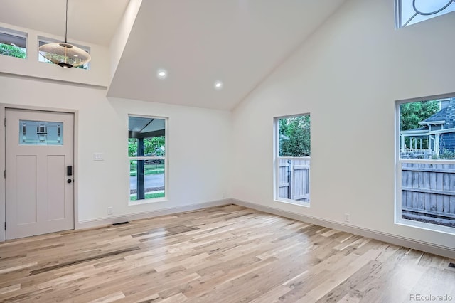 3975 Yates St, Denver, CO 80212 - foyer featuring high vaulted ceiling and light wood-style floors