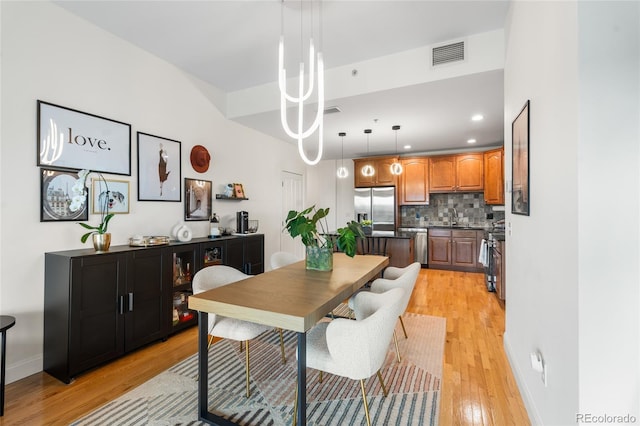 1950 N Logan St Unit 905, Denver, CO 80203 - dining room featuring light wood-type flooring, recessed lighting, and baseboards