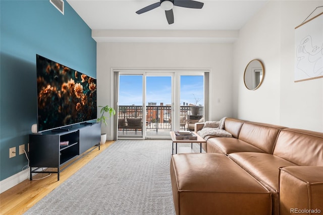 1950 N Logan St Unit 905, Denver, CO 80203 - living room with ceiling fan and wood finished floors