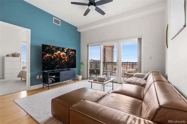 1950 N Logan St Unit 905, Denver, CO 80203 - living area featuring a ceiling fan, wood finished floors, and baseboards