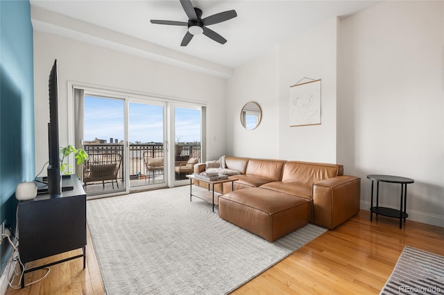 1950 N Logan St Unit 905, Denver, CO 80203 - living room with a ceiling fan and light wood-style flooring