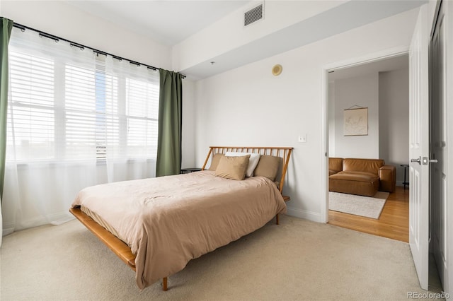 1950 N Logan St Unit 905, Denver, CO 80203 - bedroom with light colored carpet and baseboards