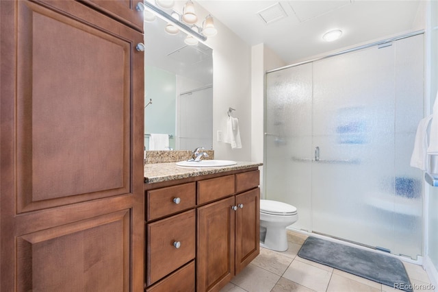 1950 N Logan St Unit 905, Denver, CO 80203 - bathroom with vanity, a shower stall, and toilet