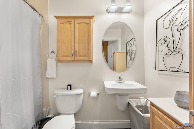 1950 N Logan St Unit 905, Denver, CO 80203 - full bathroom featuring toilet, a baseboard radiator, and shower / bath combo