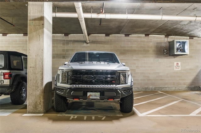 1950 N Logan St Unit 905, Denver, CO 80203 - parking deck featuring concrete block wall