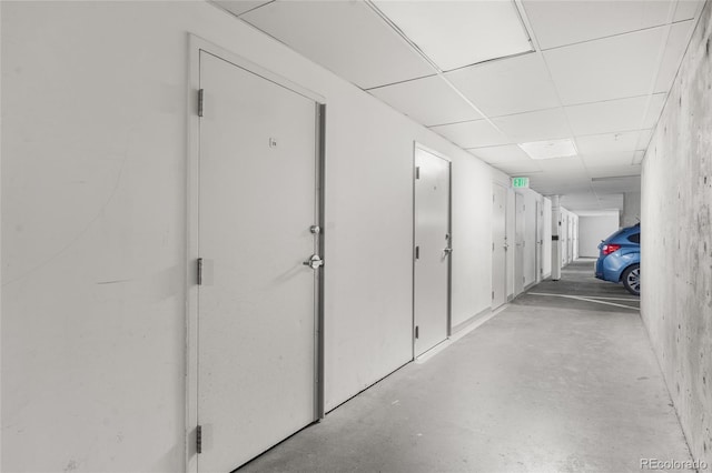 1950 N Logan St Unit 905, Denver, CO 80203 - hallway with concrete floors and a paneled ceiling