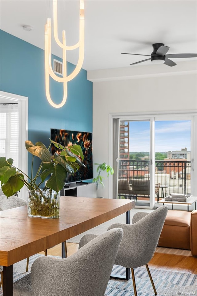 1950 N Logan St Unit 905, Denver, CO 80203 - living room featuring wood finished floors and a ceiling fan