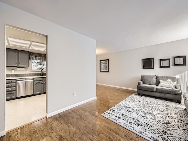 living room with light wood-style floors and baseboards