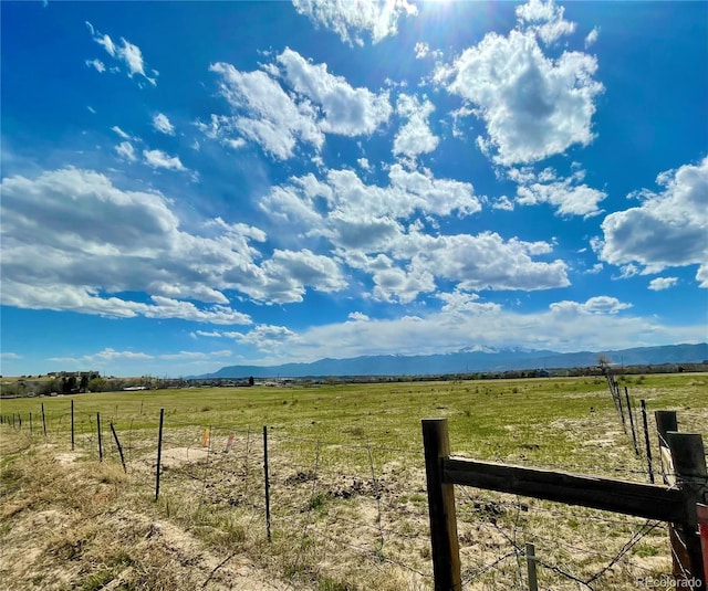 view of yard with a rural view