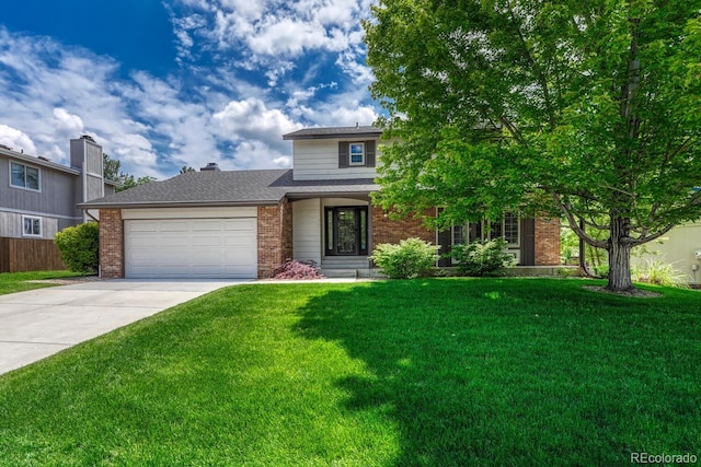 302 Northridge Rd, Highlands Ranch, CO 80126 - view of front facade featuring brick siding, driveway, and an attached garage