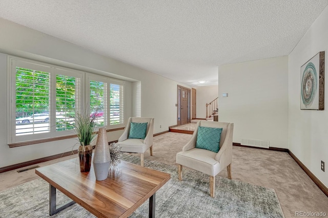 302 Northridge Rd, Highlands Ranch, CO 80126 - living room featuring light colored carpet, stairs, baseboards, and a textured ceiling