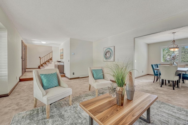 302 Northridge Rd, Highlands Ranch, CO 80126 - living area featuring light carpet, a textured ceiling, stairs, and baseboards