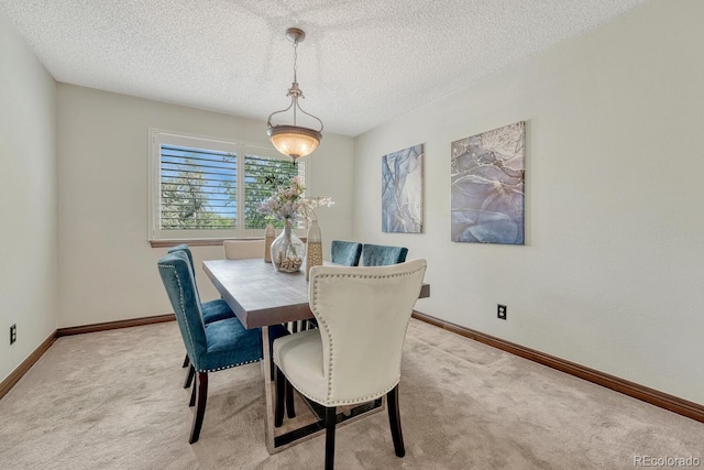 302 Northridge Rd, Highlands Ranch, CO 80126 - dining room featuring light carpet, a textured ceiling, and baseboards