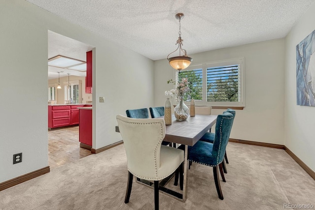302 Northridge Rd, Highlands Ranch, CO 80126 - dining space with light carpet, baseboards, and a textured ceiling