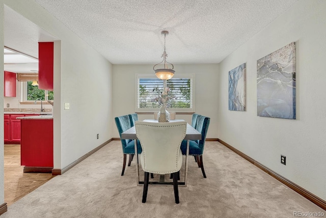 302 Northridge Rd, Highlands Ranch, CO 80126 - dining area featuring healthy amount of natural light, a textured ceiling, light carpet, and baseboards