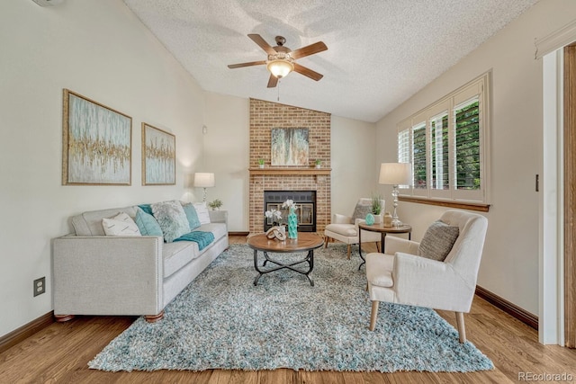 302 Northridge Rd, Highlands Ranch, CO 80126 - living room featuring vaulted ceiling, wood finished floors, a textured ceiling, ceiling fan, and baseboards