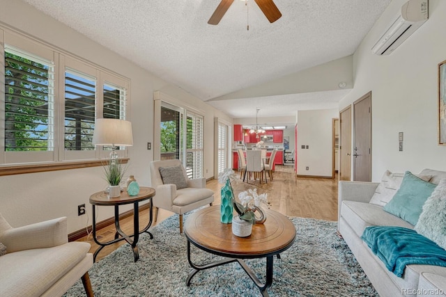 302 Northridge Rd, Highlands Ranch, CO 80126 - living area featuring an AC wall unit, a textured ceiling, vaulted ceiling, a chandelier, and light wood-type flooring