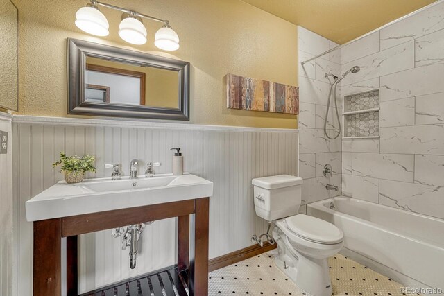 302 Northridge Rd, Highlands Ranch, CO 80126 - bathroom with wainscoting, toilet, shower / bathtub combination, and vanity