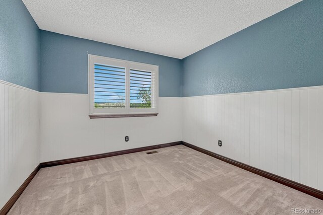 302 Northridge Rd, Highlands Ranch, CO 80126 - carpeted empty room with a textured ceiling and a textured wall