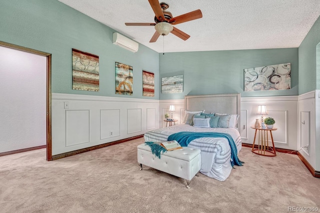 302 Northridge Rd, Highlands Ranch, CO 80126 - bedroom with an AC wall unit, a decorative wall, carpet floors, wainscoting, and a textured ceiling