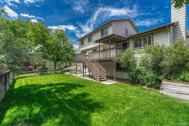 302 Northridge Rd, Highlands Ranch, CO 80126 - rear view of property featuring stairway, a wooden deck, and a chimney