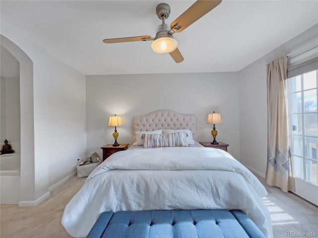 bedroom featuring ceiling fan and light colored carpet