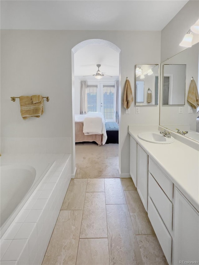 bathroom with ceiling fan, vanity, and tile patterned floors