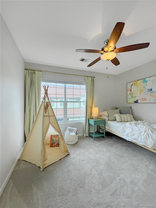 carpeted bedroom featuring ceiling fan