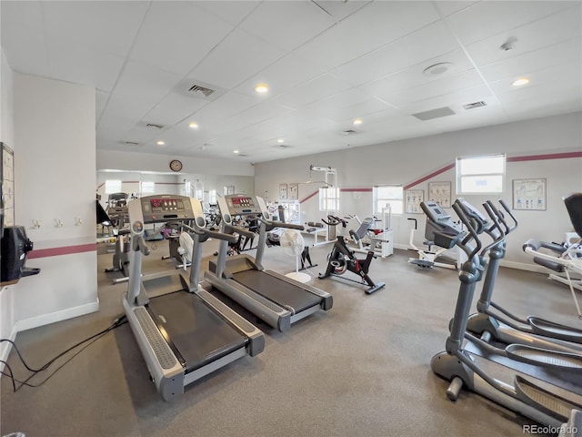 workout area featuring a paneled ceiling