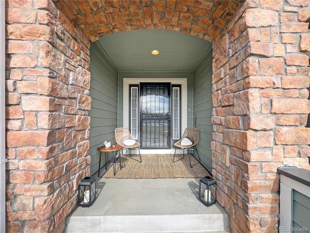 property entrance with brick siding