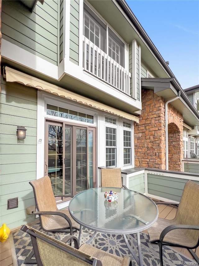 wooden deck featuring outdoor dining area