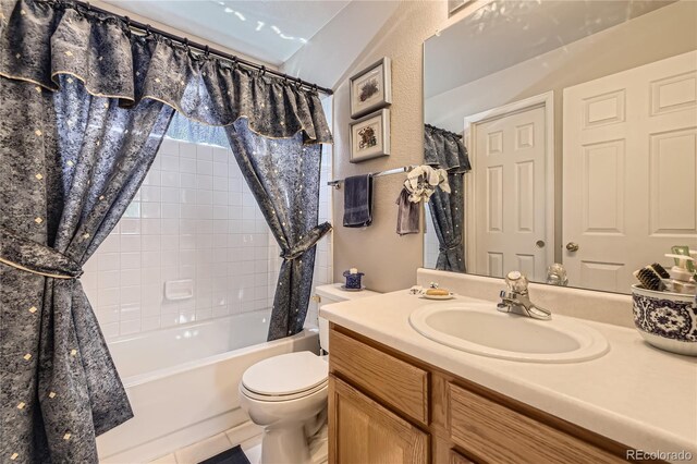 9001 W Chatfield Dr, Littleton, CO 80128 - full bathroom with shower / bath combo, toilet, vanity, and tile patterned flooring