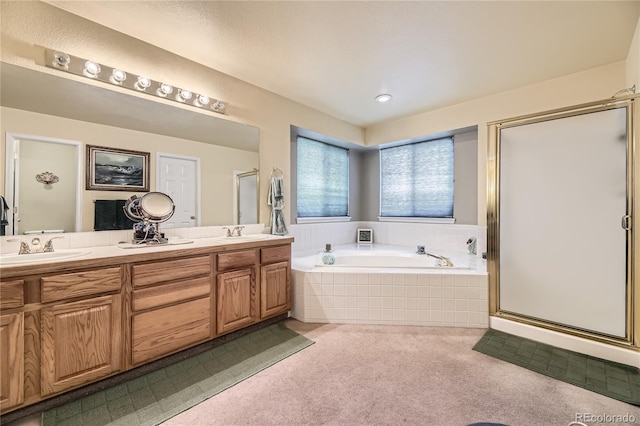 9001 W Chatfield Dr, Littleton, CO 80128 - bathroom featuring double vanity, a garden tub, and a stall shower