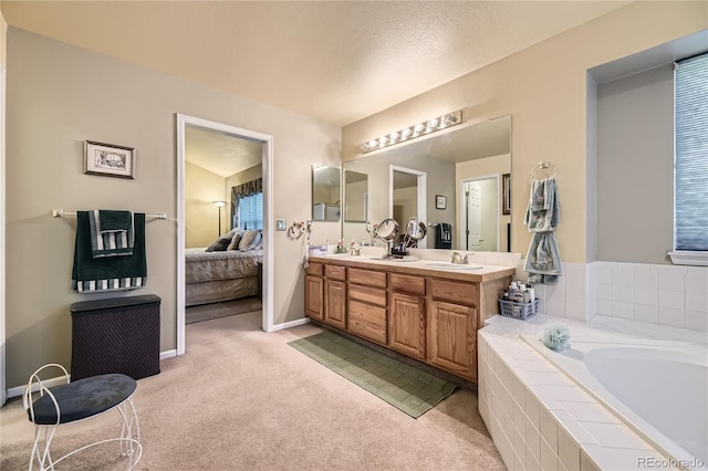 9001 W Chatfield Dr, Littleton, CO 80128 - bathroom with connected bathroom, double vanity, a bath, and baseboards