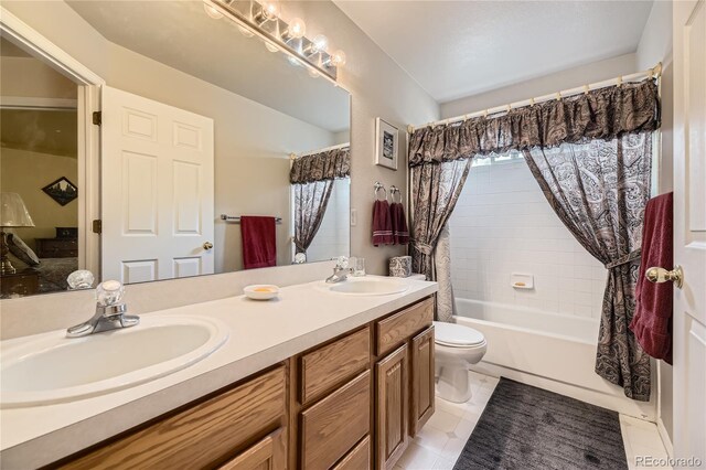 9001 W Chatfield Dr, Littleton, CO 80128 - full bathroom featuring toilet, double vanity, shower / tub combo, and tile patterned floors