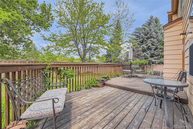 9001 W Chatfield Dr, Littleton, CO 80128 - wooden terrace featuring outdoor dining space
