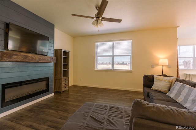 living room featuring dark wood-type flooring, vaulted ceiling, and ceiling fan