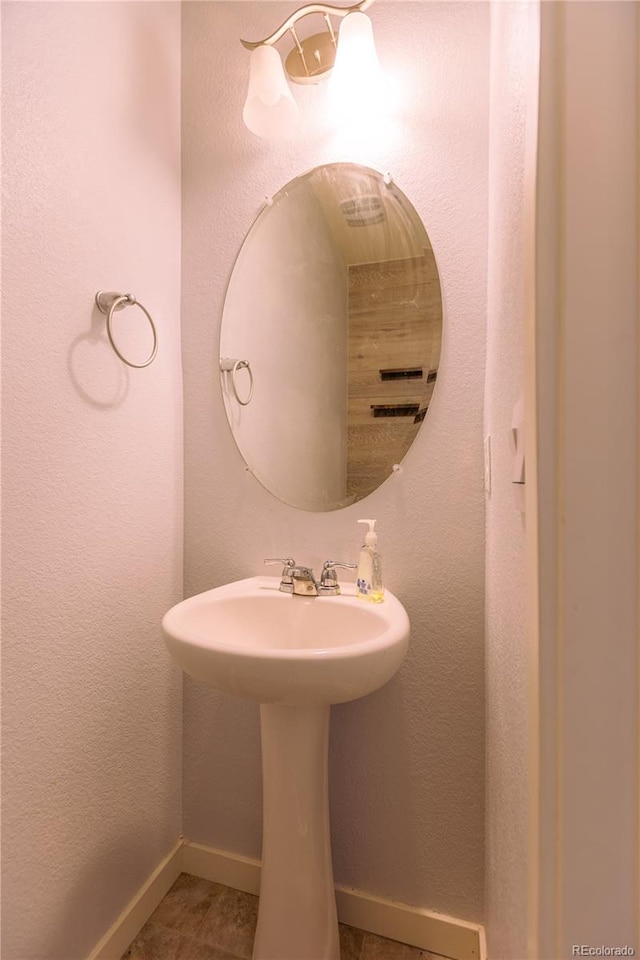 bathroom with tile patterned floors