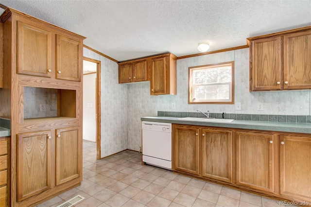 kitchen with white dishwasher, sink, ornamental molding, and a textured ceiling