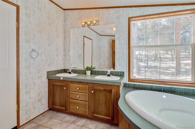 bathroom featuring crown molding, tile patterned floors, a bathtub, and vanity