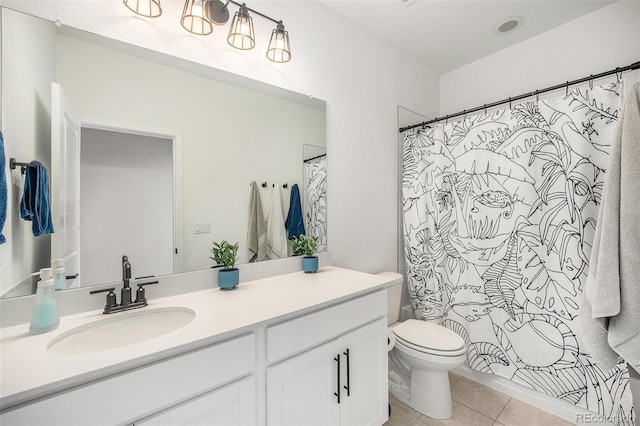 bathroom featuring tile patterned flooring, a shower with shower curtain, toilet, and vanity