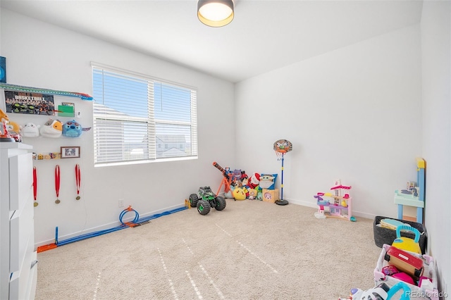 playroom with carpet floors and baseboards