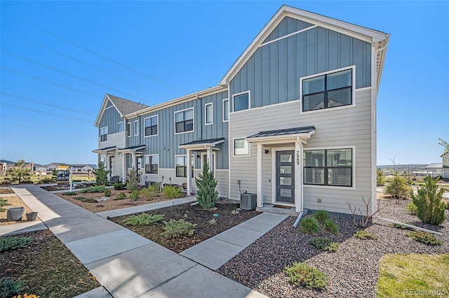 townhome / multi-family property featuring board and batten siding and a residential view
