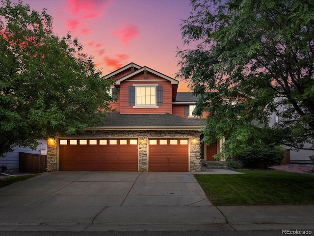 10216 Kleinbrook Way, Highlands Ranch, CO 80126 - view of front facade with stone siding, driveway, a yard, a garage, and a shingled roof