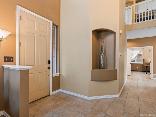 10216 Kleinbrook Way, Highlands Ranch, CO 80126 - entrance foyer featuring light tile patterned floors and a high ceiling