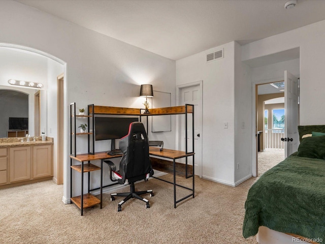 10216 Kleinbrook Way, Highlands Ranch, CO 80126 - bedroom featuring light carpet, arched walkways, and an office area